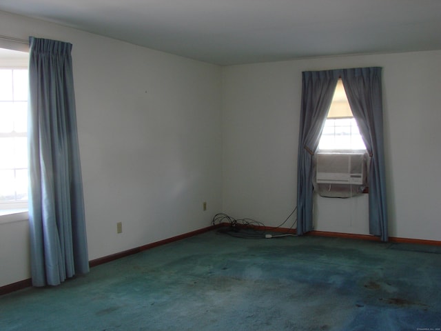 spare room with cooling unit and carpet floors