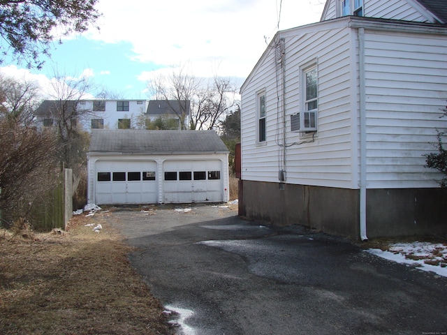 view of home's exterior with an outbuilding and a garage