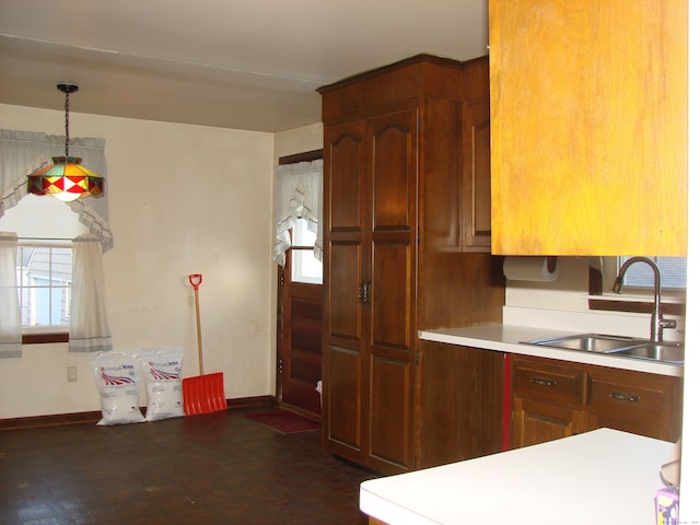 kitchen featuring decorative light fixtures and sink