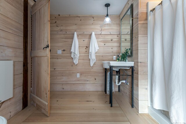 bathroom with wooden walls