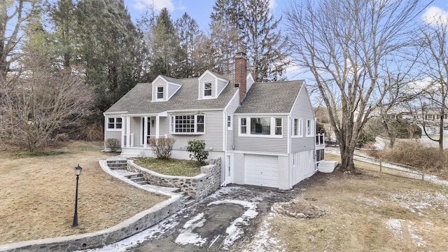 cape cod home with a garage