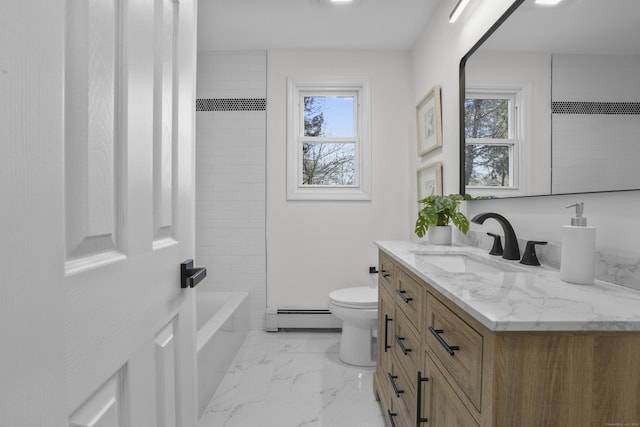 full bathroom featuring toilet, vanity, baseboard heating, and tiled shower / bath combo