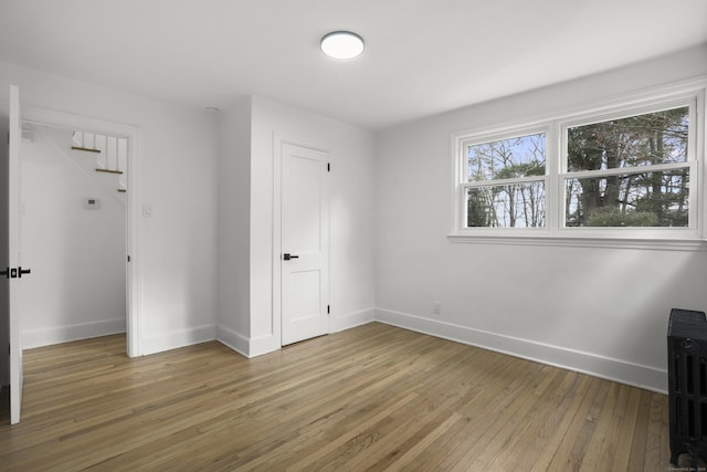 unfurnished bedroom featuring hardwood / wood-style floors