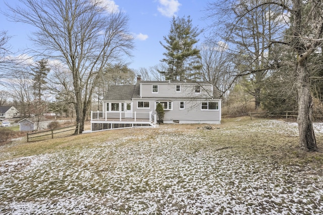 rear view of house featuring a deck