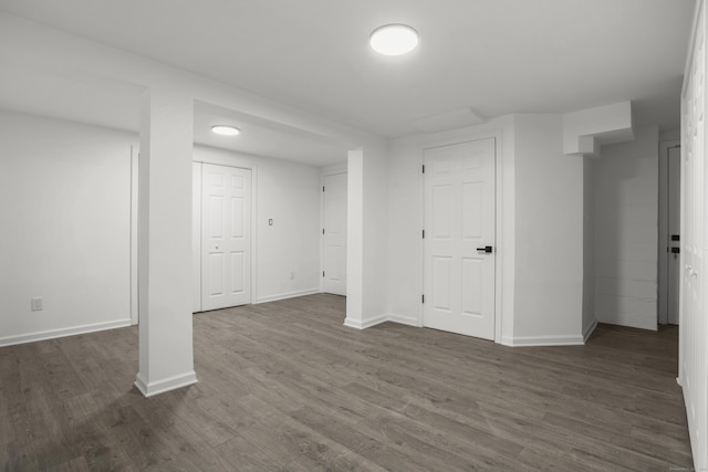 basement featuring dark hardwood / wood-style floors