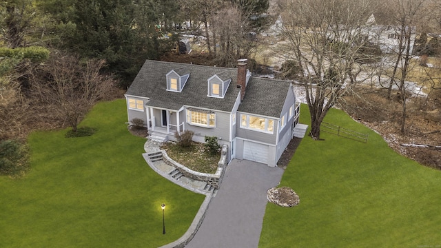 cape cod-style house with a front lawn and a garage