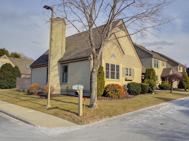 view of side of home featuring a yard