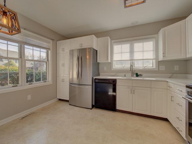 kitchen with sink, white cabinetry, stainless steel fridge, and dishwasher