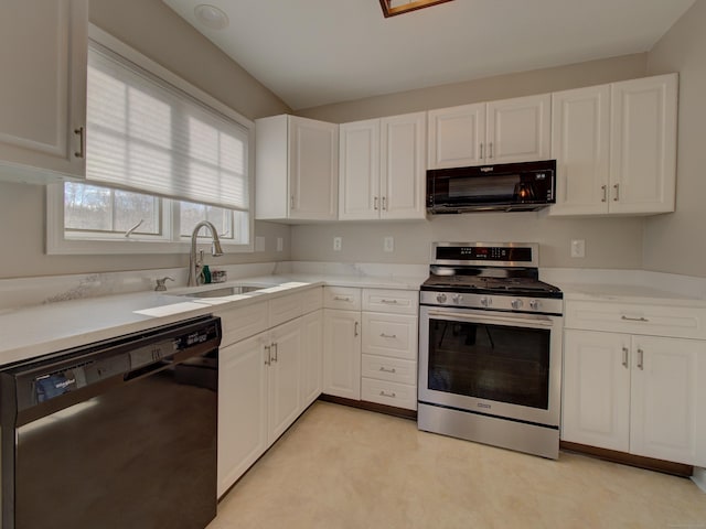 kitchen featuring white cabinetry, sink, and black appliances