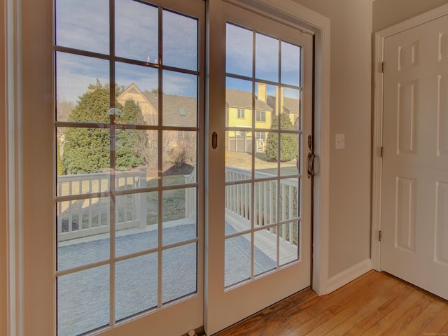 entryway with light hardwood / wood-style floors