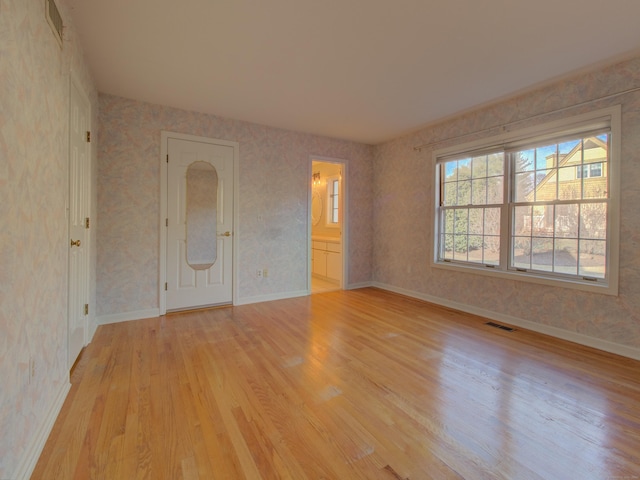 spare room featuring light hardwood / wood-style flooring