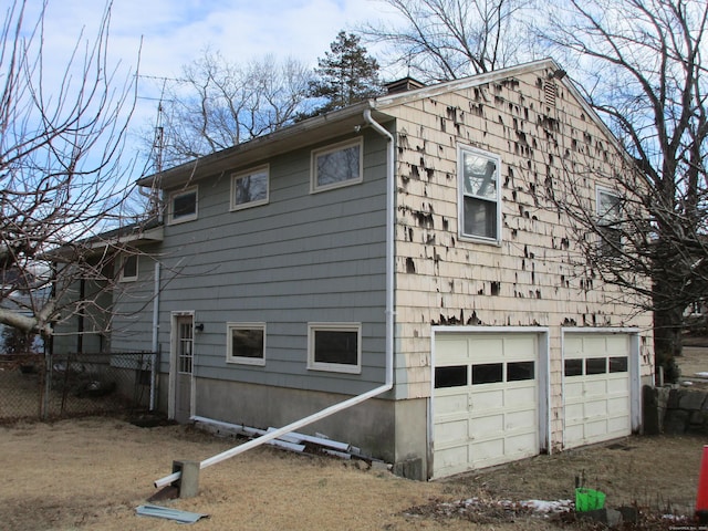 view of side of property featuring a garage