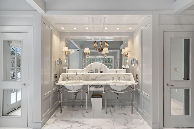 bathroom featuring coffered ceiling and crown molding