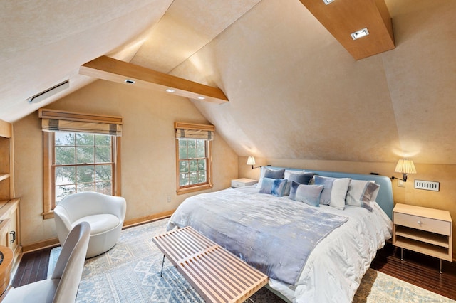 bedroom featuring hardwood / wood-style flooring, multiple windows, and lofted ceiling with beams