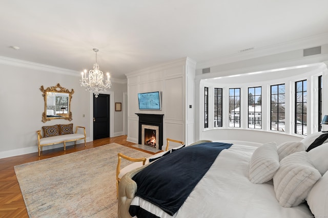 bedroom featuring ornamental molding, a fireplace, visible vents, and a chandelier