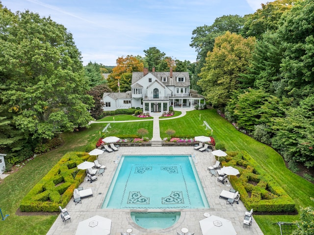 exterior space featuring a lawn and a patio