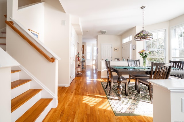 dining area featuring light wood-type flooring