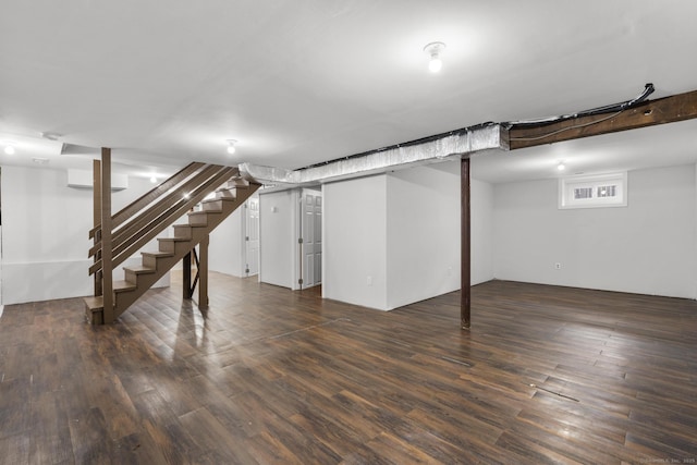 basement featuring dark wood-type flooring