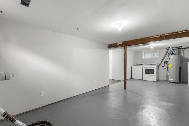 basement featuring independent washer and dryer and gas water heater