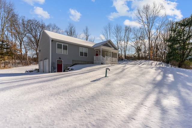 view of front of property featuring a garage and covered porch