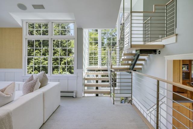 interior space featuring a wealth of natural light and a baseboard radiator