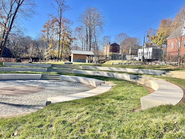 view of home's community featuring a lawn