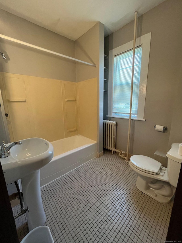 full bath featuring baseboards, radiator heating unit, tile patterned floors, toilet, and shower / bathtub combination