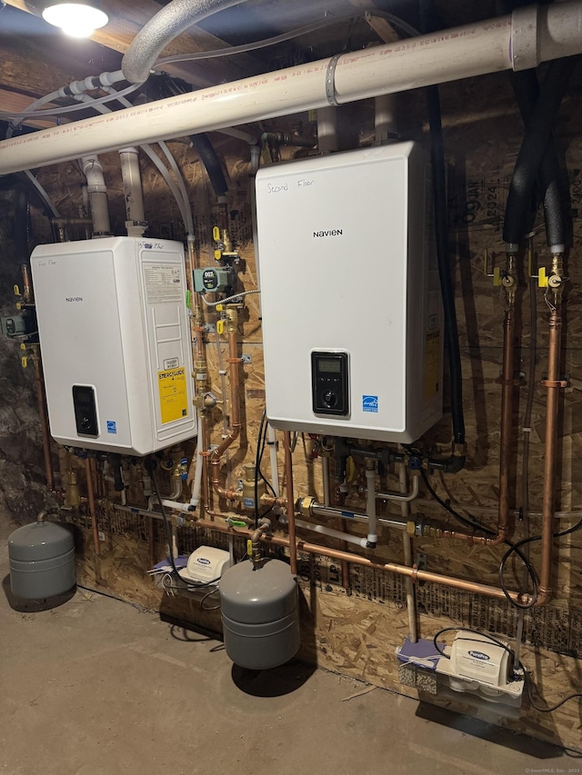 utility room featuring tankless water heater