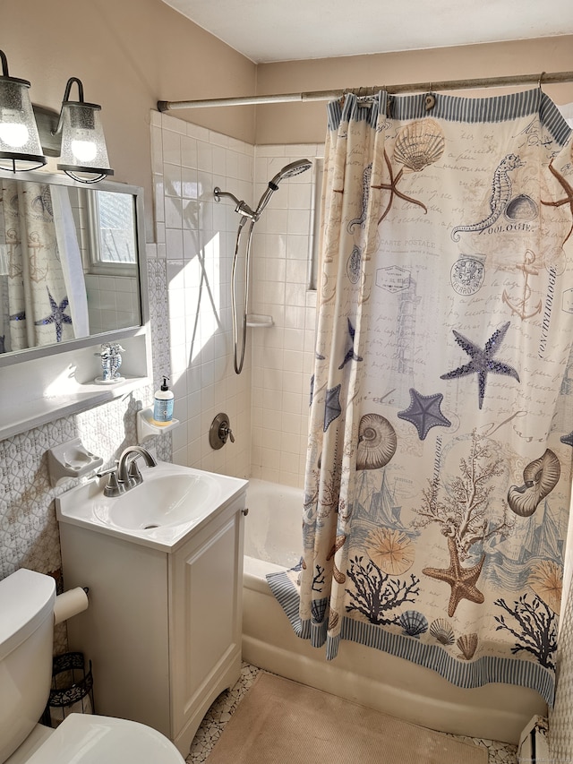 full bathroom with toilet, vanity, and shower / tub combo with curtain