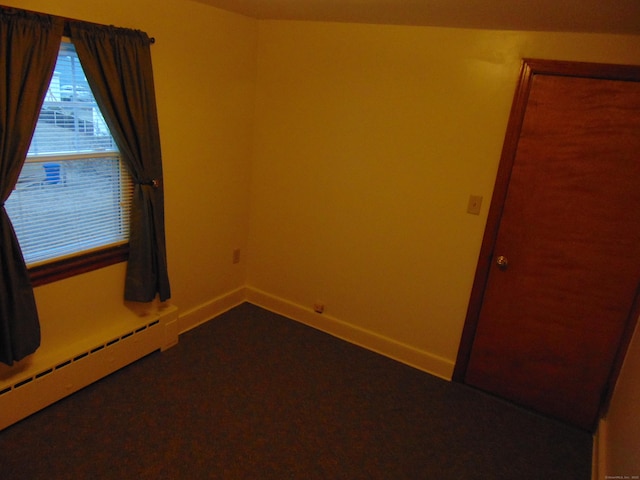 unfurnished room featuring a baseboard radiator