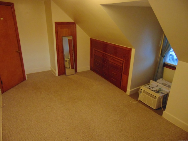 bonus room with light colored carpet and lofted ceiling