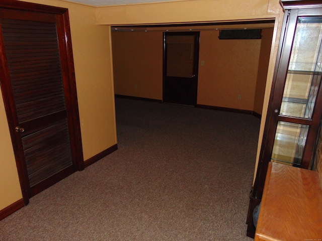 corridor with dark carpet