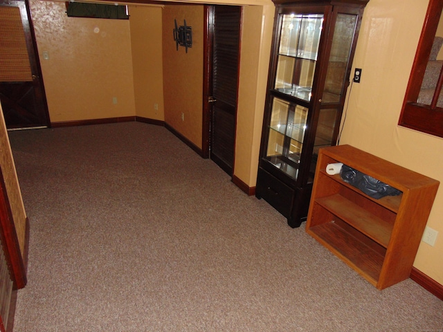 corridor featuring carpet flooring