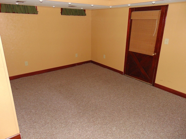 empty room featuring carpet flooring