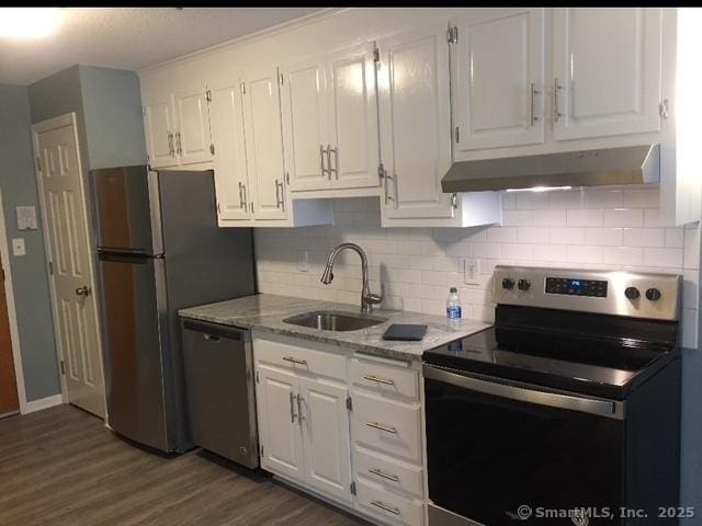 kitchen featuring sink, dark wood-type flooring, white cabinetry, and stainless steel appliances