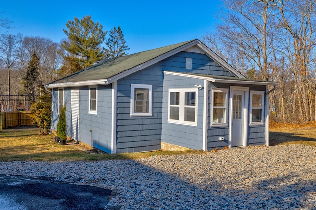 view of side of property with an outdoor structure