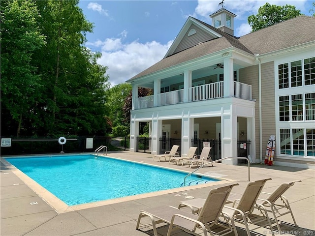 view of pool featuring ceiling fan and a patio