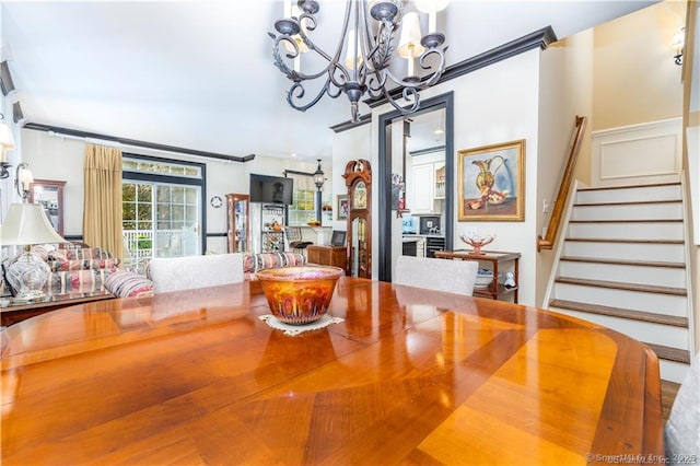 dining area featuring a notable chandelier