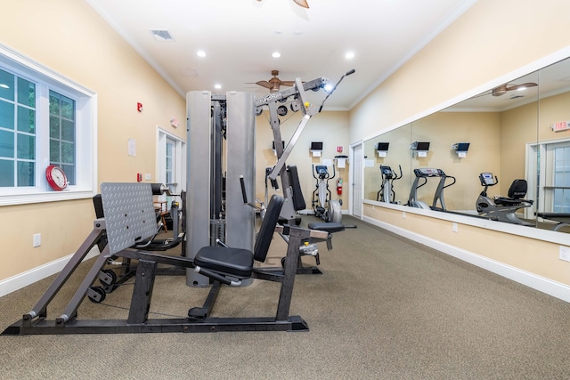 gym with ceiling fan and crown molding