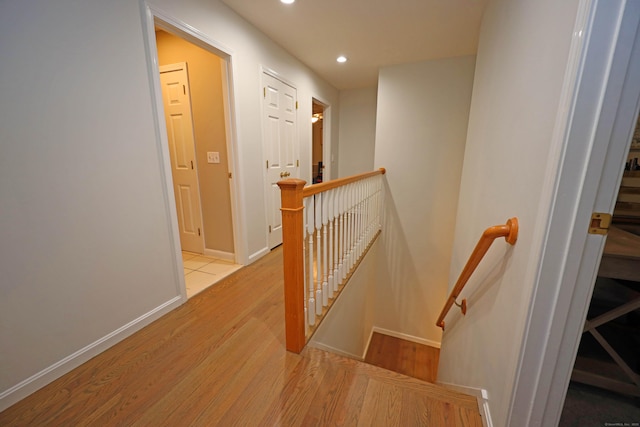 stairway featuring hardwood / wood-style floors