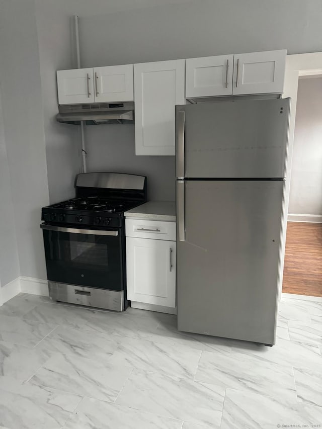 kitchen featuring stainless steel appliances and white cabinetry