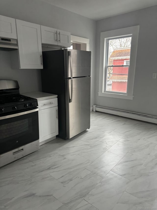 kitchen featuring a baseboard radiator, white cabinets, and appliances with stainless steel finishes