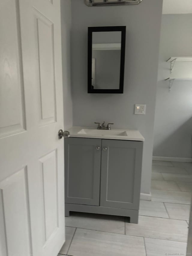 bathroom with vanity and tile patterned flooring