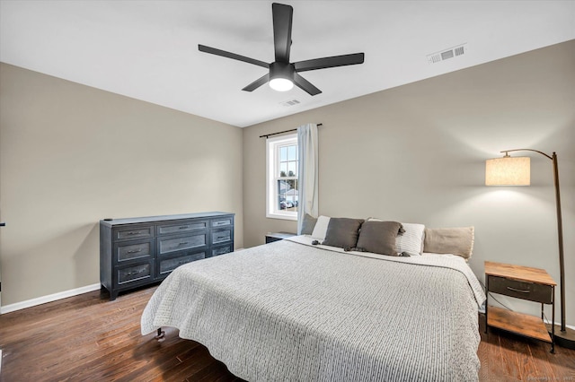 bedroom featuring ceiling fan and dark hardwood / wood-style floors