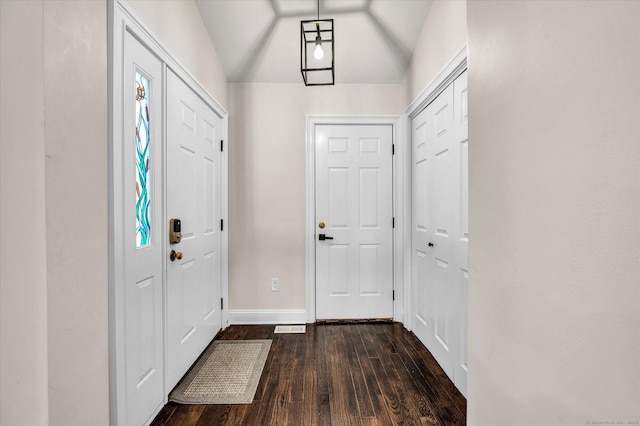 entryway featuring dark hardwood / wood-style flooring and vaulted ceiling