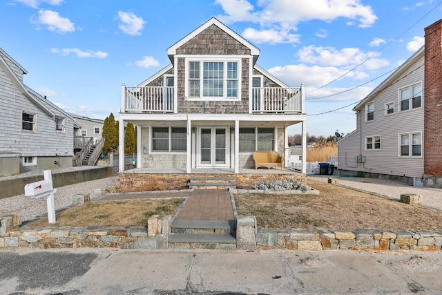 view of front of home with a balcony and covered porch