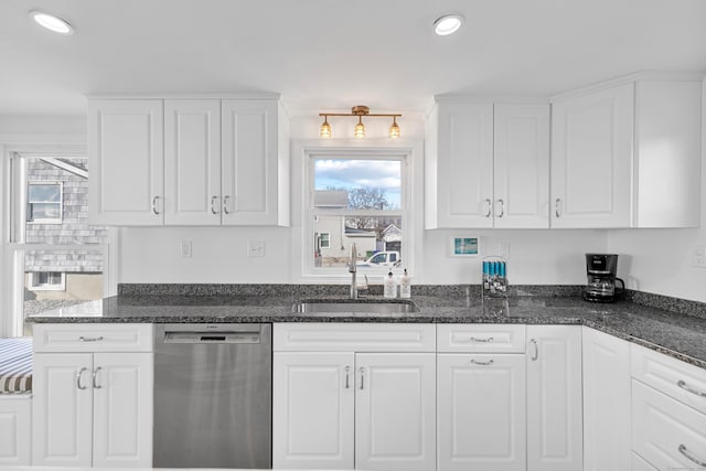 kitchen with sink, white cabinetry, dishwasher, and a wealth of natural light