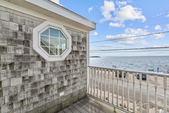 balcony featuring a water view