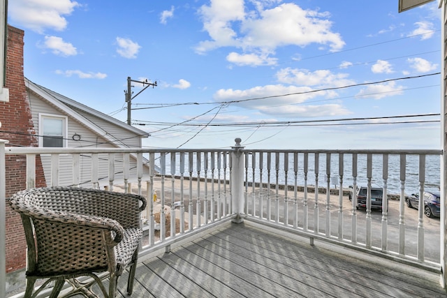 wooden deck with a water view