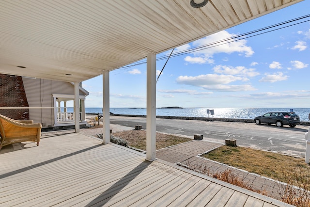 wooden deck with a water view